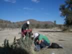 Filling our water bladders from a hand pump! (66kb)